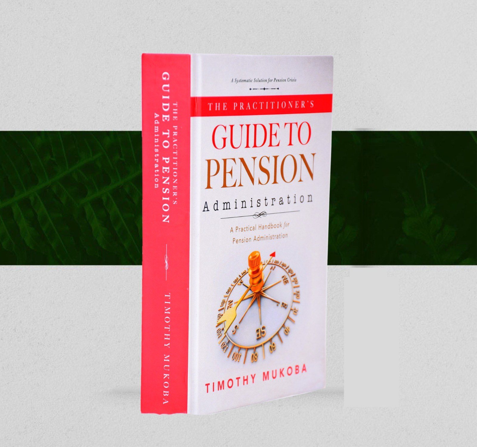 The Practitioner's Guide to Pension Administration standing upright, showing the red spine and the front cover